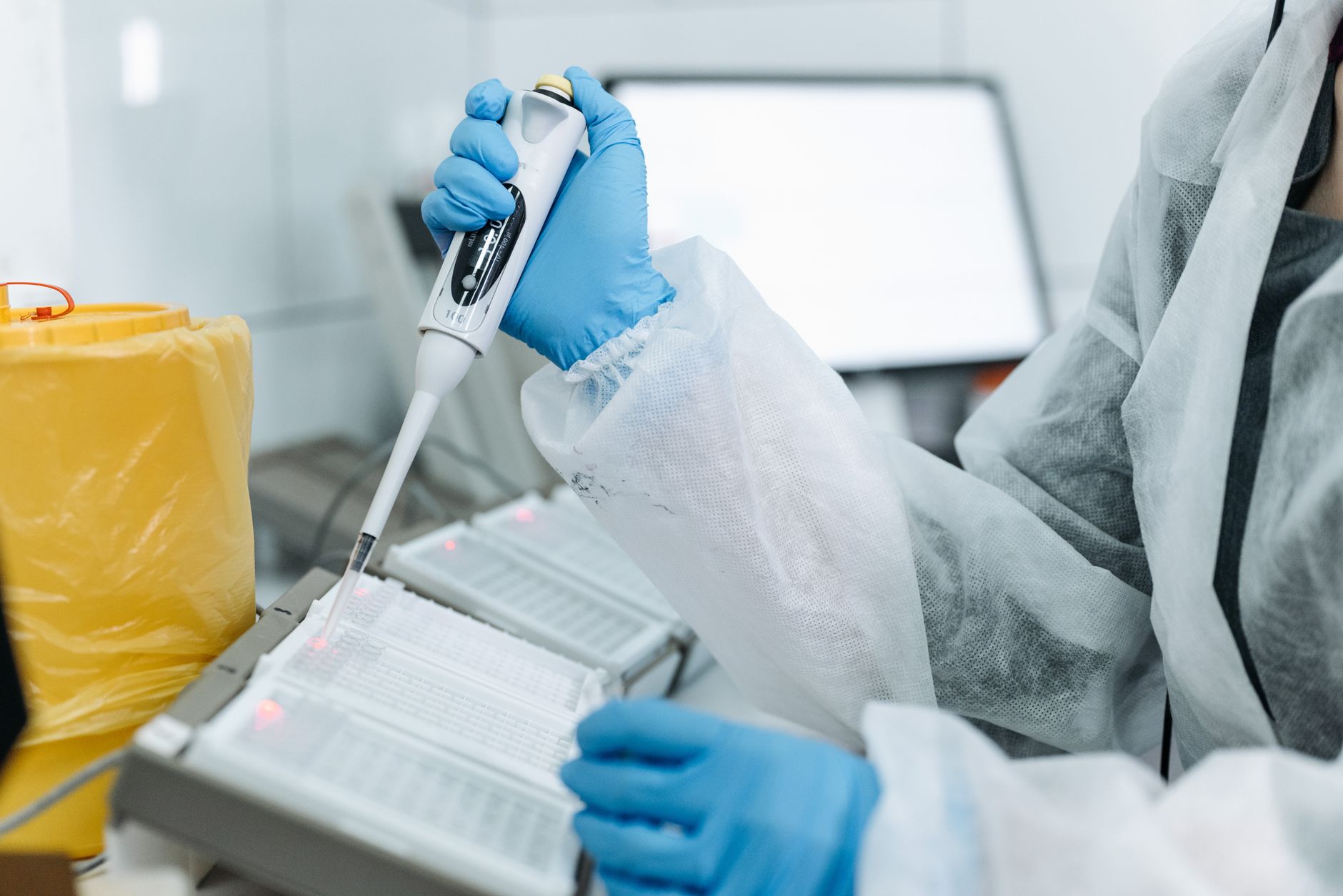 Laboratory hand with a pipette preparing samples